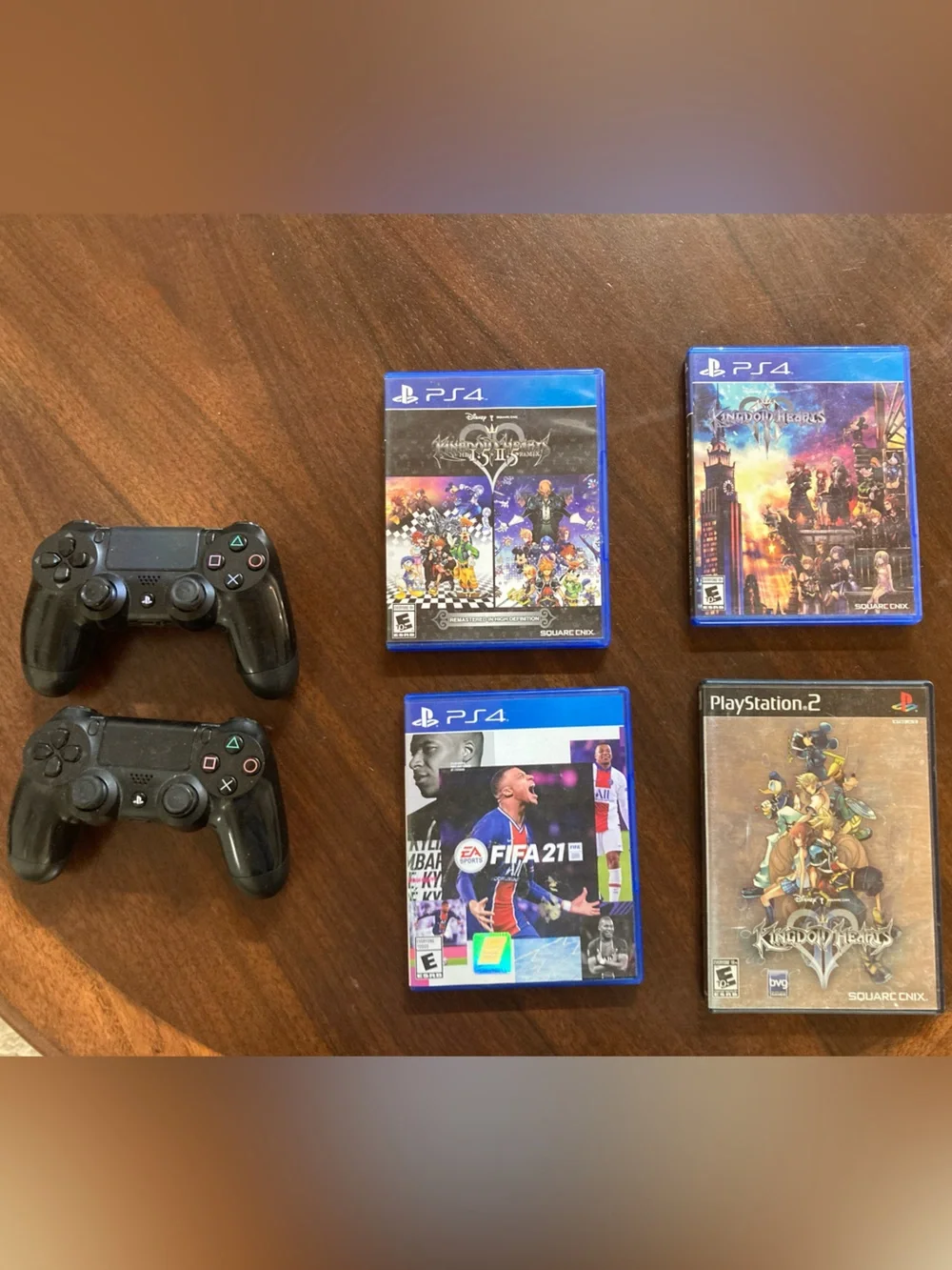 2 Black Wireless PS4 Controllers with Four PS Games